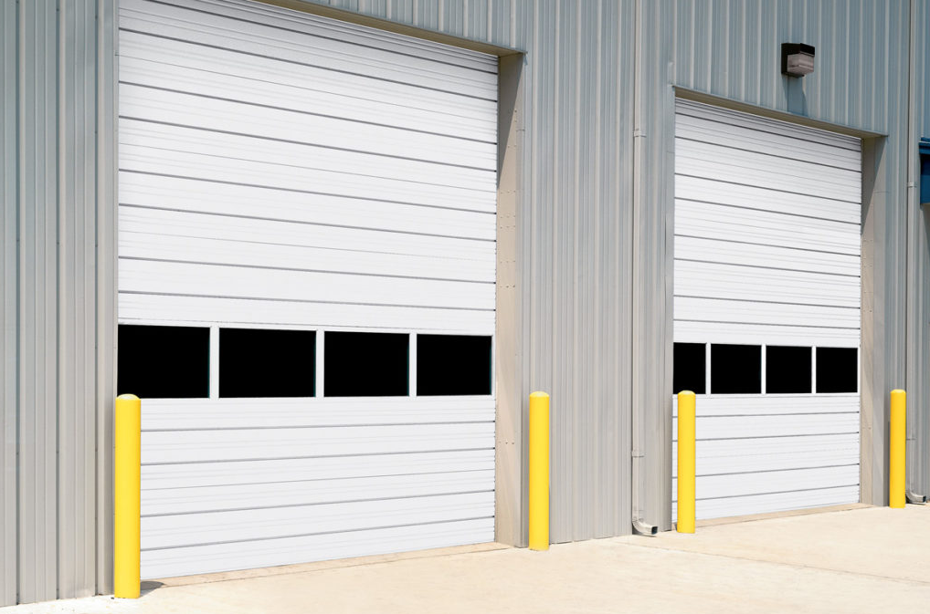 Professional technician providing expert commercial garage door repair services in Fort Pierce, FL