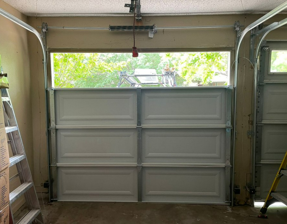 Garage door technician performing track repair in Parkland, FL - Expert garage door track repair services