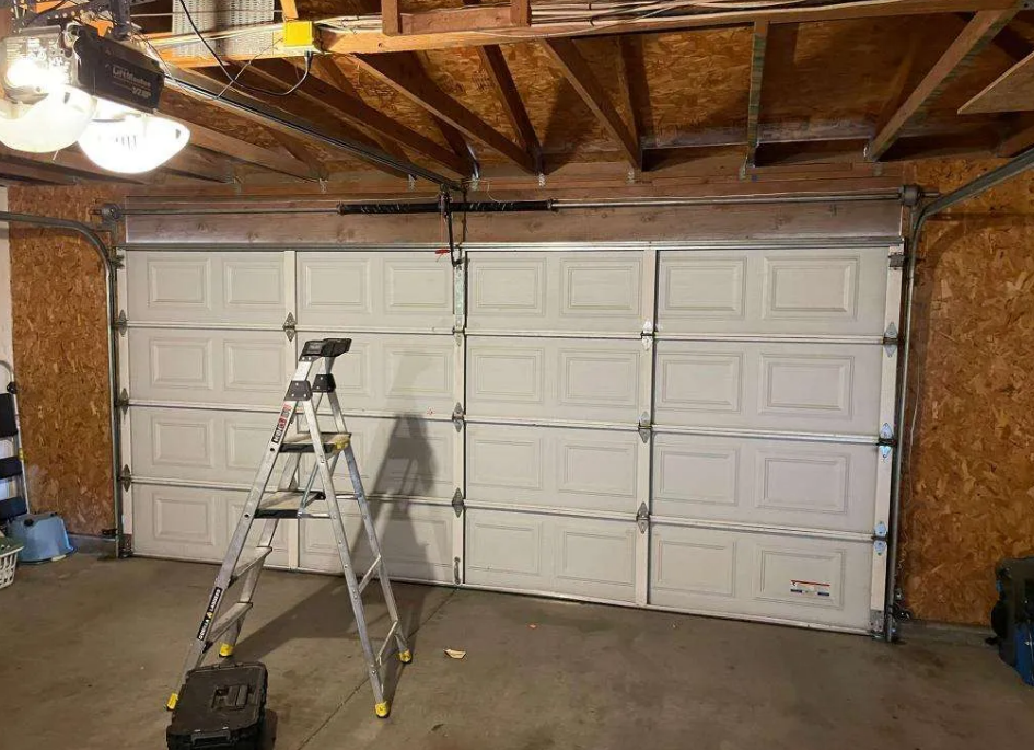 A professional technician from Parkland Garage Door Repair Services conducting a local garage door repair, showcasing efficient and quality service in Parkland, FL.