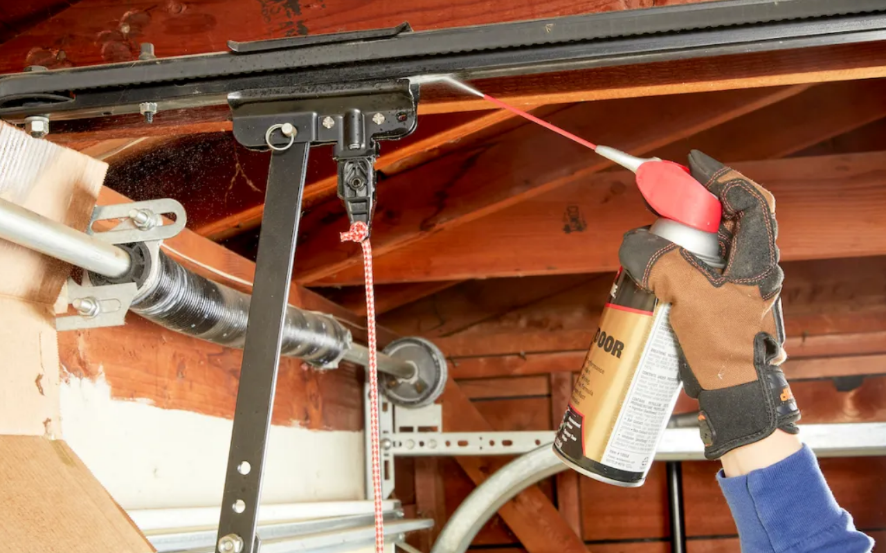 Professional technician repairing a noisy garage door in Parkland, FL to ensure smooth and quiet operation.