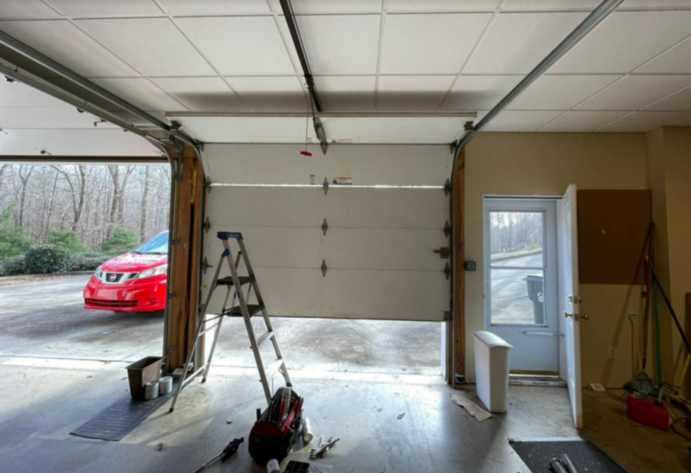 Professional garage door replacement service in Parkland, FL showcasing a team of experts installing a new garage door for improved home security and aesthetics.