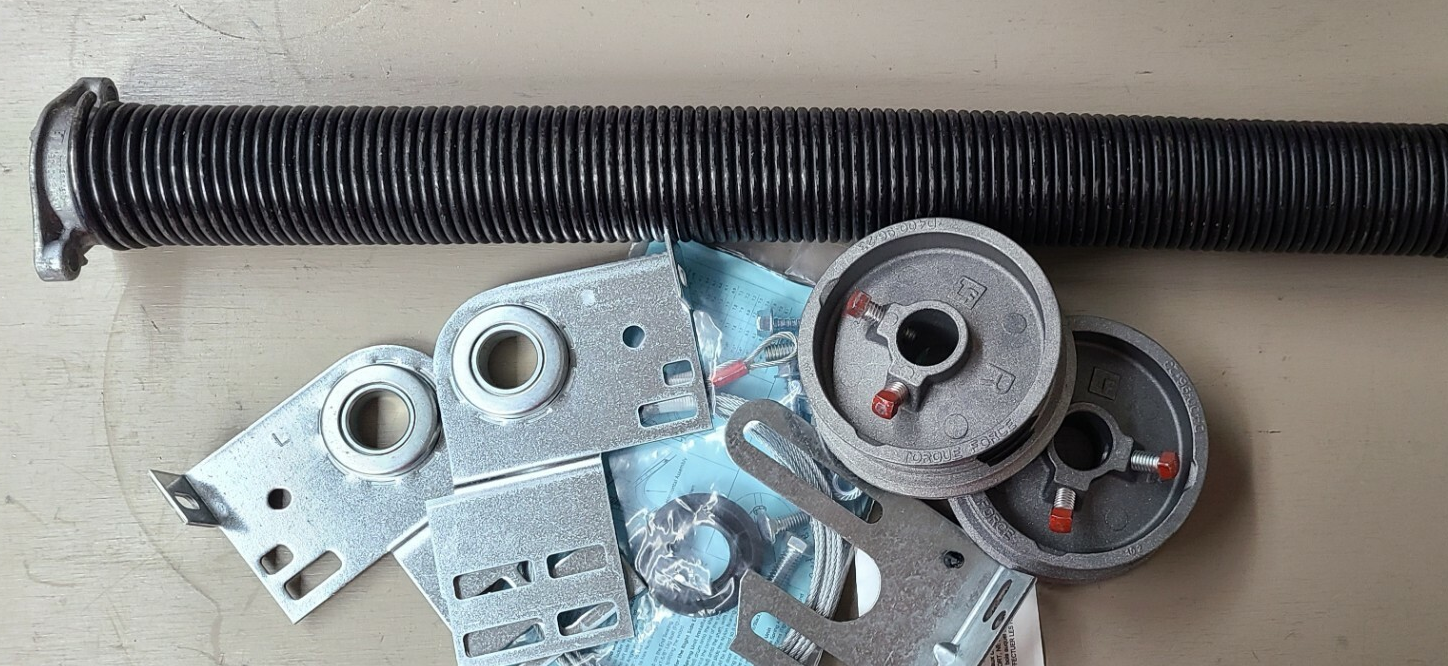 Close-up view of technician repairing a garage door spring in Parkland, FL, showcasing expert garage door repair services.
