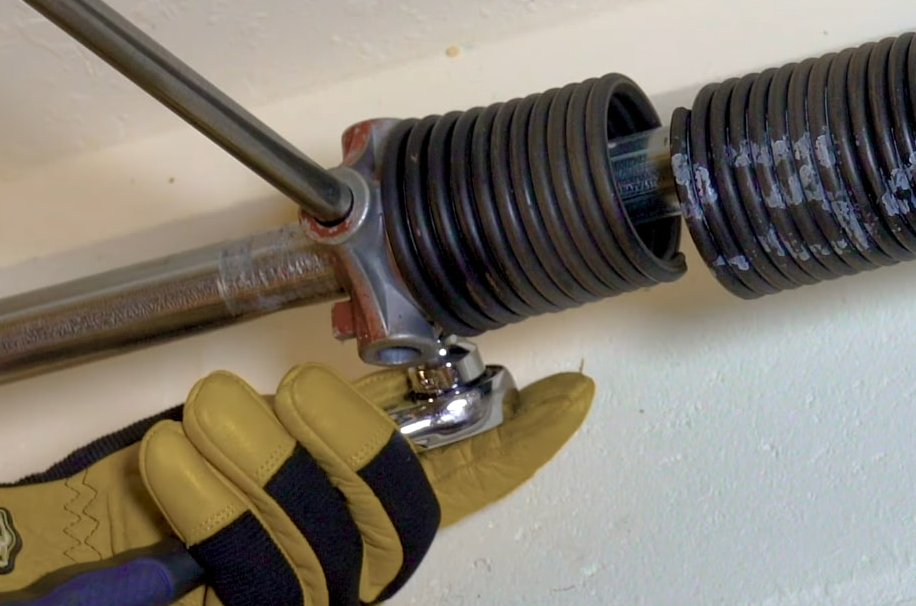 Garage door spring repair service by Parkland FL Garage Door Repair Services, showcasing a technician fixing a garage door spring for enhanced home safety and functionality.