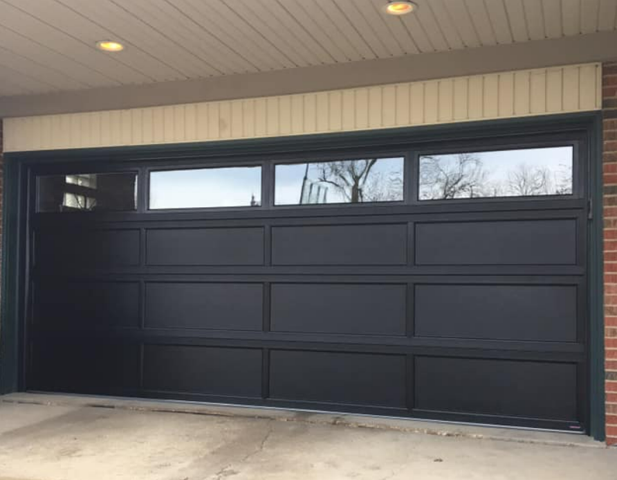 Professional technician repairing a residential garage door in Parkland, FL, showcasing expert garage door repair services and high-quality maintenance solutions.