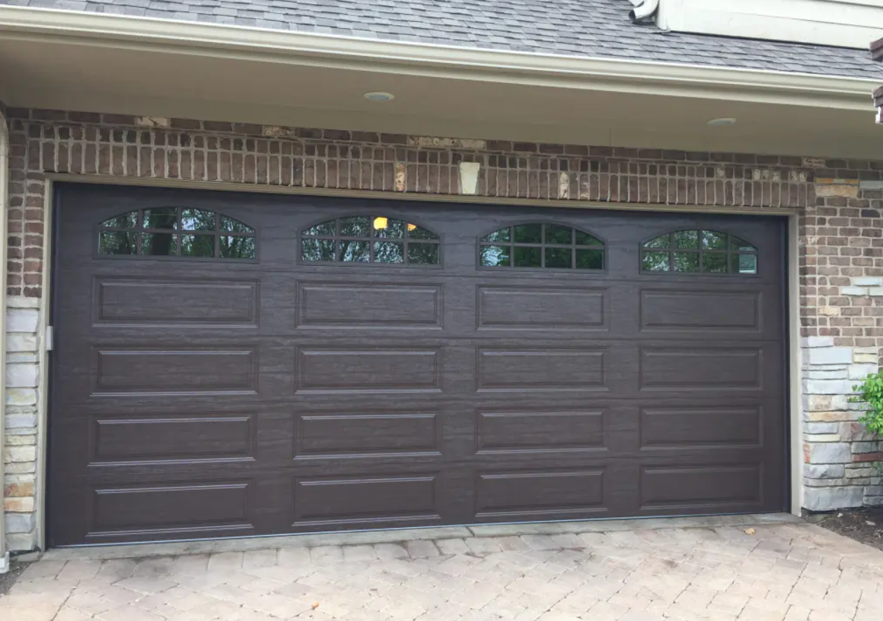 Close-up of a professional technician repairing a residential garage door in Parkland, FL, highlighting expert services by Parkland FL Garage Door Repair Services.
