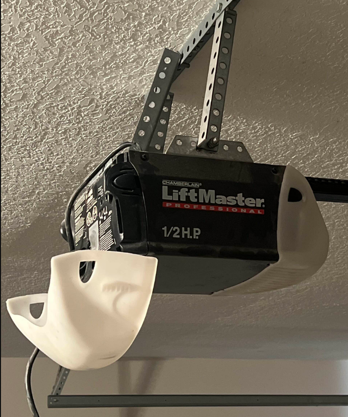 Garage door opener installation service by Parkland FL Garage Door Repair Services showcasing a technician expertly installing a new garage door opener in a residential garage.